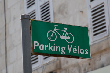 Obraz premium parking velo text french means bike park urban furniture for parking bicycles with panel white green