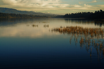 Obraz premium Looking south to the Southern Alps across Lake Mahinapua, Hokitika, New Zealand.