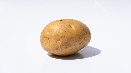 Single Fresh Potato on a Clean White Background