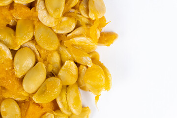 Raw seeds from fresh hokkaido pumpkin on a white background