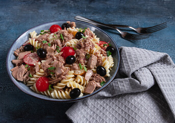 fusilli pasta salad with canned tuna, cherry tomatoes and olives, parmesan, microgreens, homemade, no people,