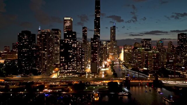 Hyperlapse drone shot approaching the skyline of Chicago, moody evening in USA