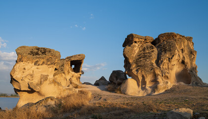 Historical Forty Stairs Rock and Phrygian rock chambers by Lake Emre. Phrygian valley. Travel...
