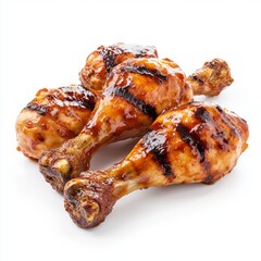 Close up of BBQ Grilled chicken drumsticks on an isolated white background
