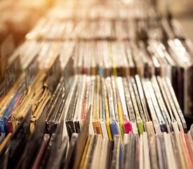Fototapeta premium Vinyl record collection. Shallow focus background with plenty of copy space. Selection of discs at music store.
