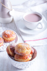 Donuts with sugar and cinnamon served with cocoa. Traditional dessert for Carnival.