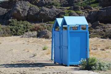 Blue dressing cubicles at the beach