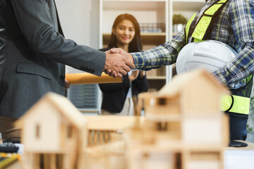 Fototapeta premium Team architects workers, men and women, join hands to join forces to join forces to work for the industry for success. Teamwork and professional colleagues : Workers' hands, teamwork concept.