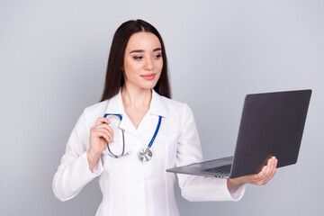 Photo of lovely woman qualified specialist therapist wear white doctor robe medical center isolated on grey color background