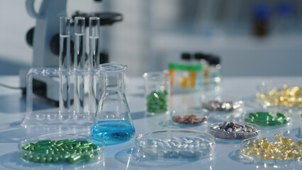 On a laboratory setting, a research table with many petri dishes containing different drugs. Drug research scene, modern science concept