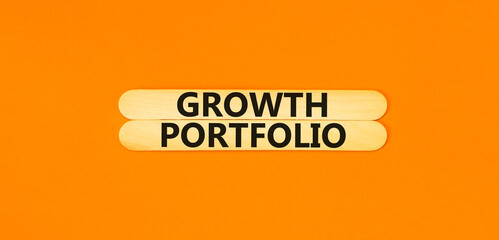 Growth portfolio symbol. Concept words Growth portfolio on beautiful wooden stick. Beautiful orange paper background. Business Growth portfolio concept. Copy space.