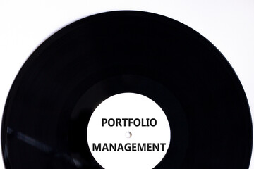 Portfolio management symbol. Concept words Portfolio management on beautiful white black vinyl disk. Beautiful white paper background. Business Portfolio management concept. Copy space.