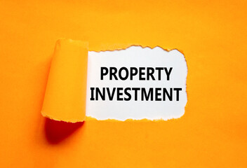 Property investment symbol. Concept words Property investment on beautiful white paper. Beautiful orange paper background. Business Property investment concept. Copy space.