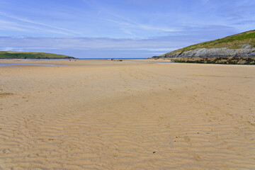 The wide expanse of Crantock beach at low tide.