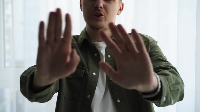 Hand gesture "stop, don't do this"
A man is trying to stop someone.
Gesticulation with hands