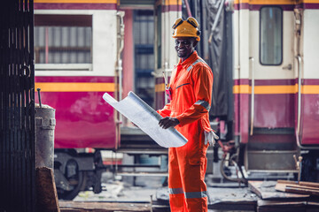 Fototapeta premium Engineers use blueprints for rail maintenance and troubleshooting to ensure safe train operations.