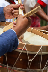 hands of a man playing the drum