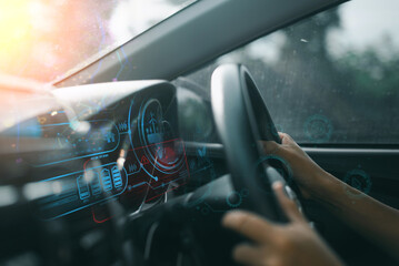 Close-up of hands on steering wheel with futuristic digital dashboard display, showcasing advanced...