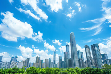 Obraz premium Skyscrapers Viewed from Below with Blue Sky and White Clouds