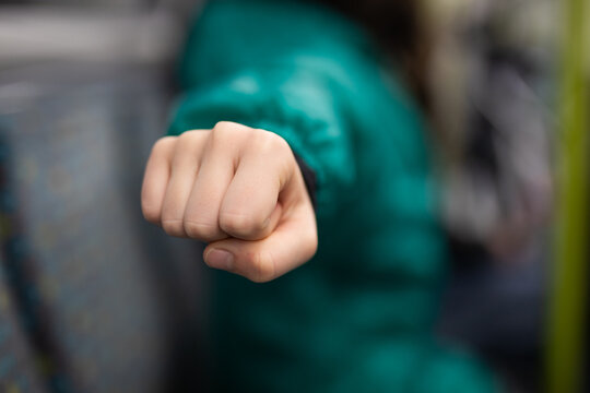 small hand child caucasian fist punch anger defence fight