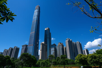 Obraz premium Skyscrapers Viewed from Below with Blue Sky and White Clouds