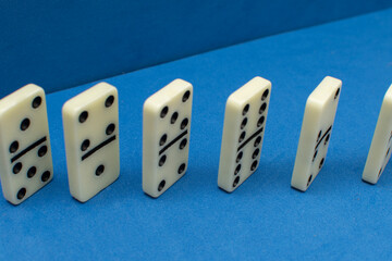 Dominoes bones on blue background	