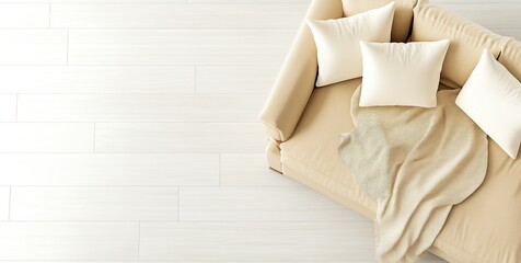 A modern living room showcases a beige sofa adorned with a blanket, accompanied by a light grey tile floor, illuminated beautifully in cinematic lighting