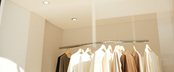 Beige Clothing Hanging on a Rack in a Store