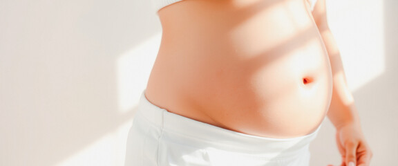 Closeup of a pregnant woman's belly