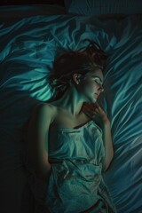 Sleeping woman in bed with night light glowing, creating a peaceful and cozy atmosphere.
