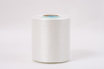  A close-up of a single large spool of white fiberglass yarn with a blue core, isolated against a plain white background.