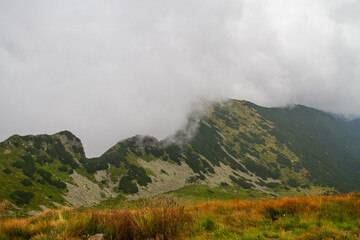 Beautiful mountain landscape with clouds and fog. 