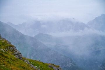 Beautiful mountain landscape with clouds and fog. 