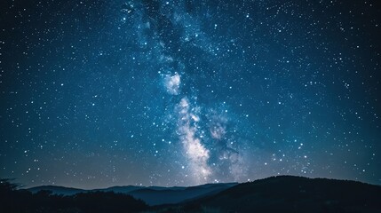 Fototapeta premium A clear, starry night sky over a serene landscape, symbolizing dreams, hope, and the realization of success