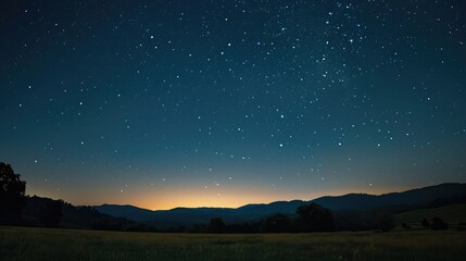 Fototapeta premium A clear, starry night sky over a serene landscape, symbolizing dreams, hope, and the realization of success