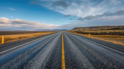 Fototapeta premium A smooth, open road leading into the horizon, representing the journey to success and endless possibilities