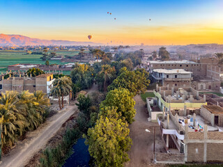 Fly over the ancient wonders of Luxor and see a panorama of vibrant hot air balloons against the...