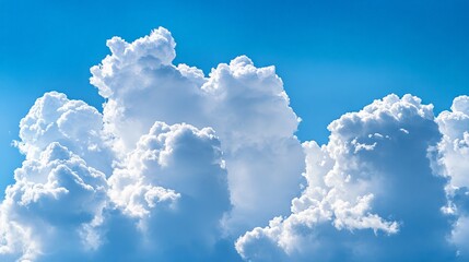 A dramatic view of clouds breaking apart to reveal a patch of blue sky. The contrast between the dark, stormy clouds and the bright, clear sky adds a sense of drama and resolution to the scene