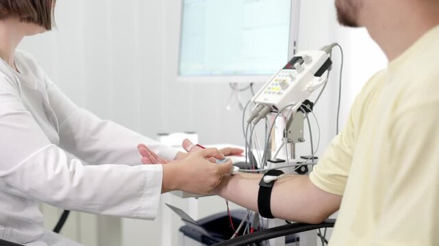  Electromyography for testing patient nerve activity. A modern medical test to detect nerve and muscle issues. Perfect for showcasing professional diagnostics.