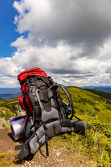 Obraz premium Hiking in the mountains with a backpack in summer.