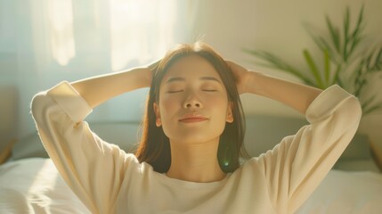 Fototapeta premium Young woman enjoying a peaceful moment with eyes closed, relaxing at home, sunlight streaming through the window.