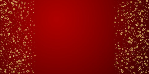 Gold sparkling star confetti.