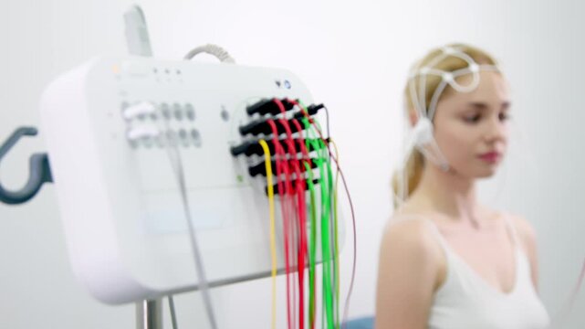 Female patient undergoing an EEG test, showcasing modern healthcare and patient comfort. Perfect for highlighting advanced diagnostic technology and patient-centered care.