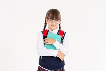 An engaged teen girl looks excited, hugging book, capturing a moment of epiphany or getting an idea, isolated on white
