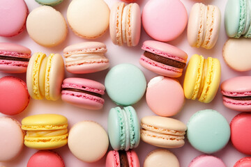 Fototapeta premium Colorful french macarons background, top view