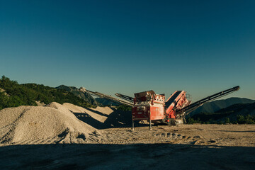 Fototapeta premium Excavators extracts the clay into open industrial quarry