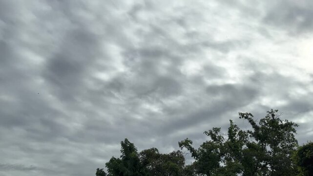 Small Silhouette Airplane Flying On Murky Sky Background With Clouds At Bangkok, Thailand. 20 July 2024. A.M.