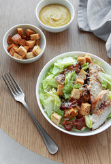 A bowl  of  Caesar salad