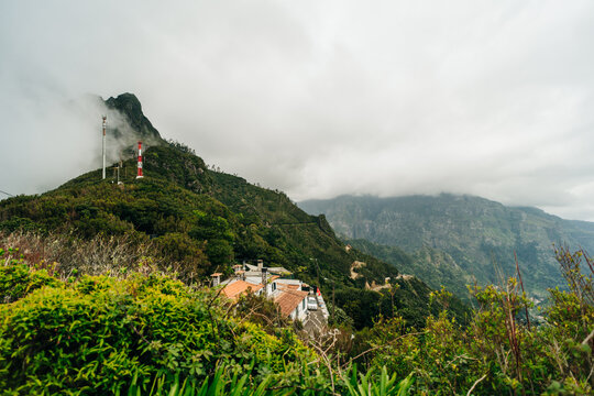 Magical misty green forest with waterfalls in Levada do Norte, Madeira island, Portugal. PR17 Pinaculo e Folhadal