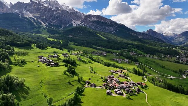 Aerial view above Val di Tires, with the Catinaccio - Torri del Vajolet Rosengarten in the background, South Tyrol, Italy